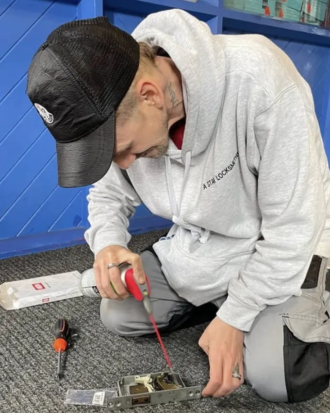 Dan working on a lock mechanism